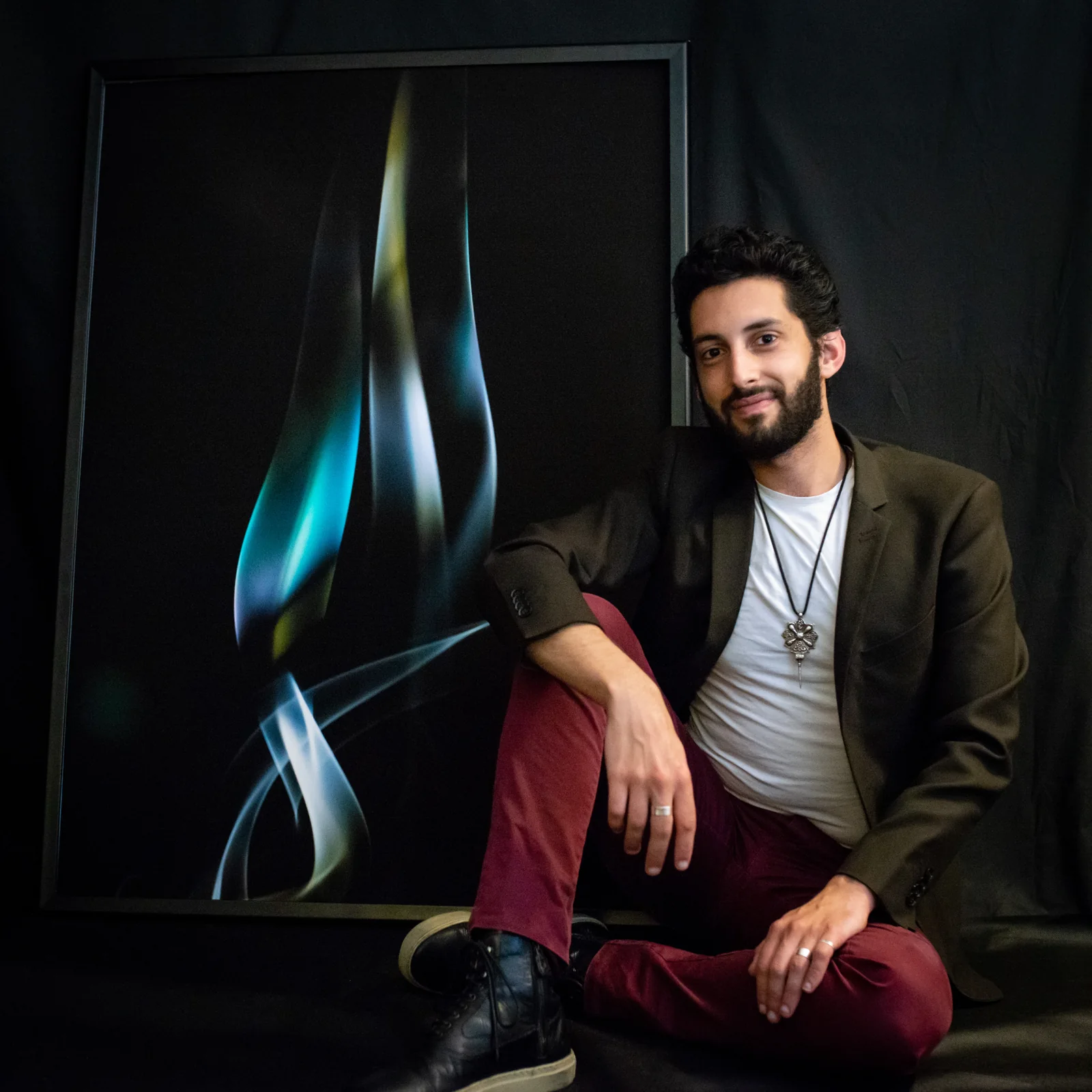 Raphaël with a large photographic print of his light experiments.