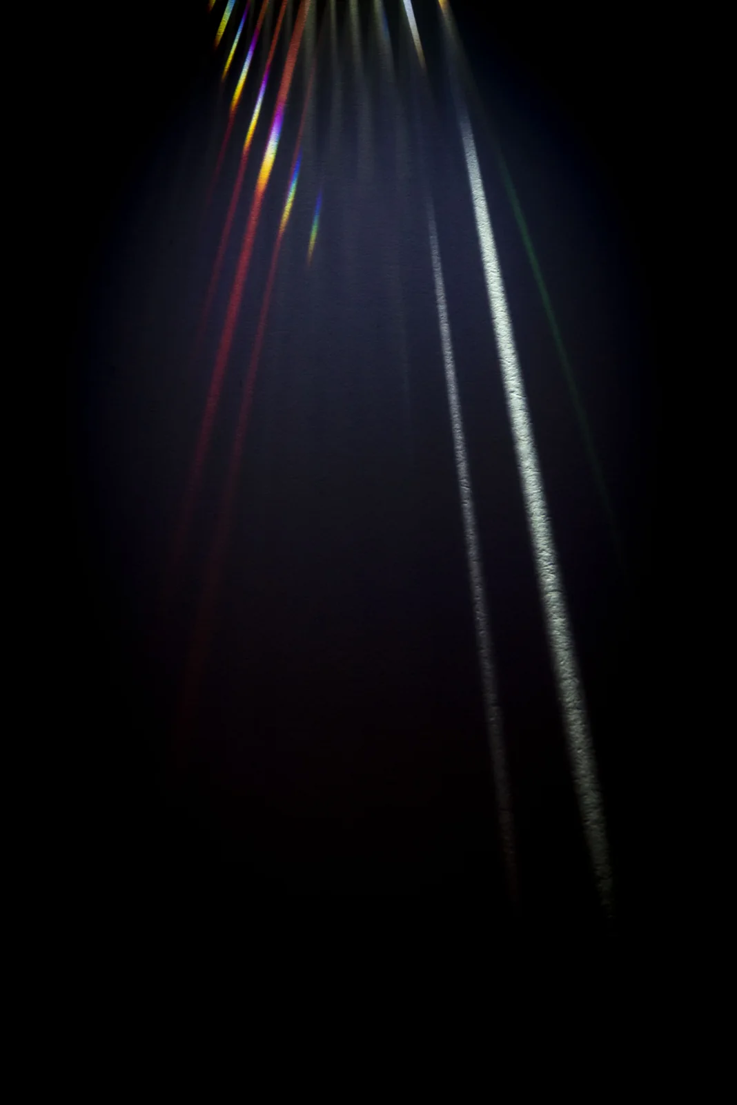 A fine spectrum of coloured light in darkness.
