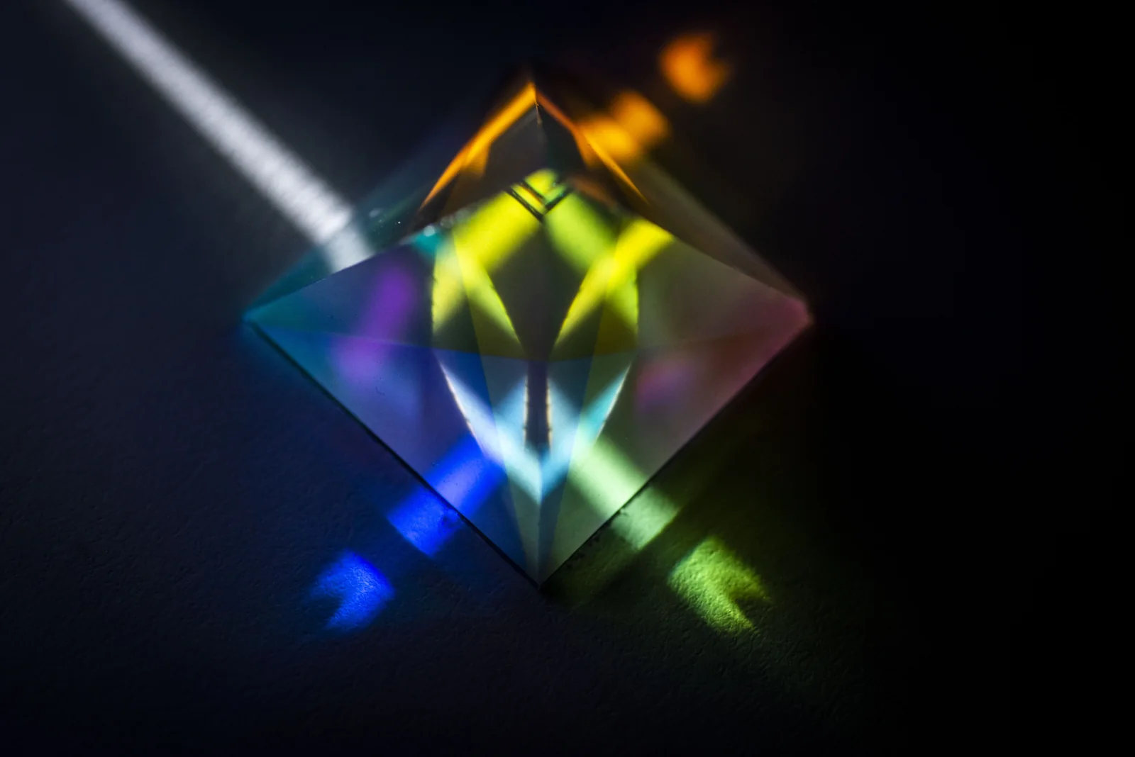 Yellow and blue light within a crystal prism.