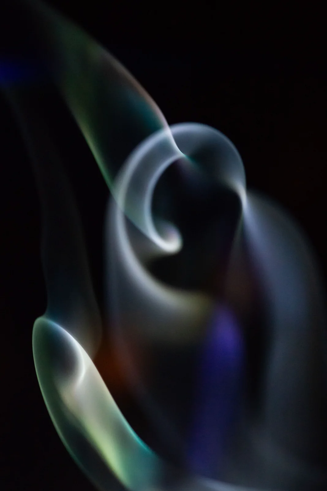 Curving waves of refracted light.