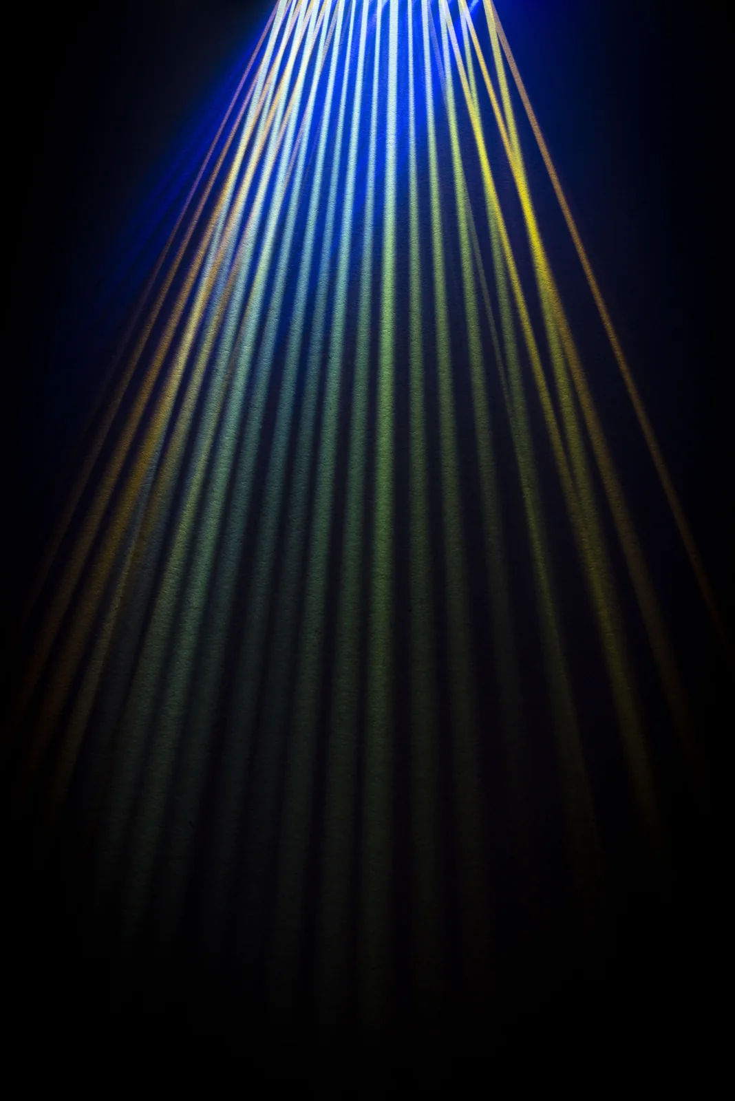 A fan of coloured light beams.