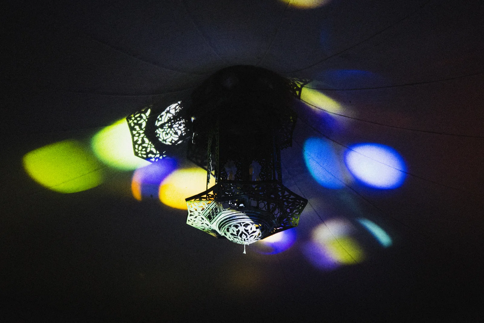 Light and colour cast onto a visitor’s hand.