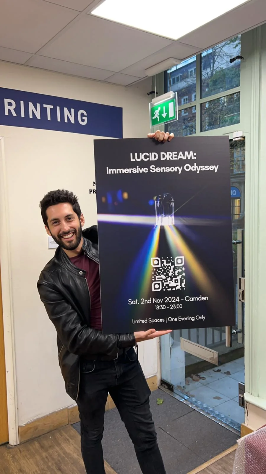 Raphaël holding the poster for the November 2024 Lucid Dream event.