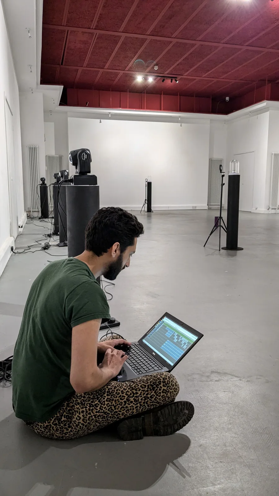 Programming the show in the empty gallery.