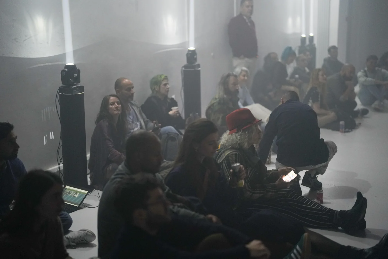 Visitors seated in the gallery for the immersive experience.