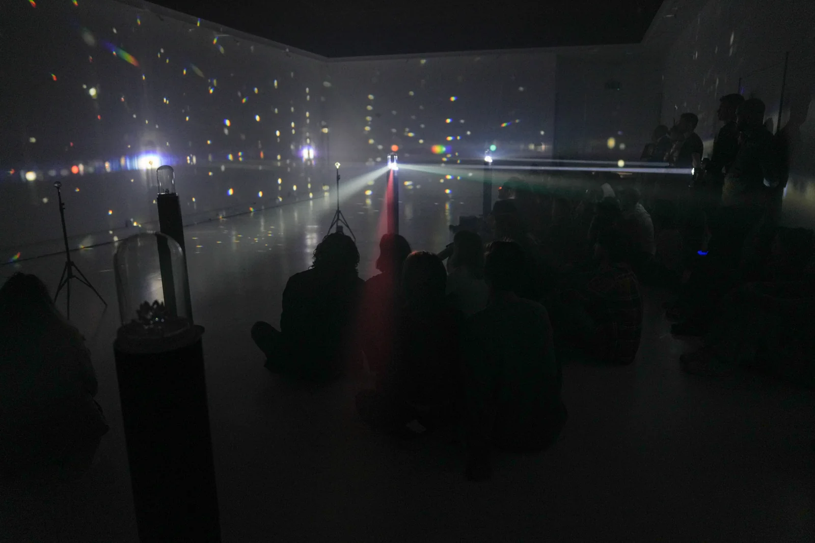 The final gallery installation filled with light and smoke.